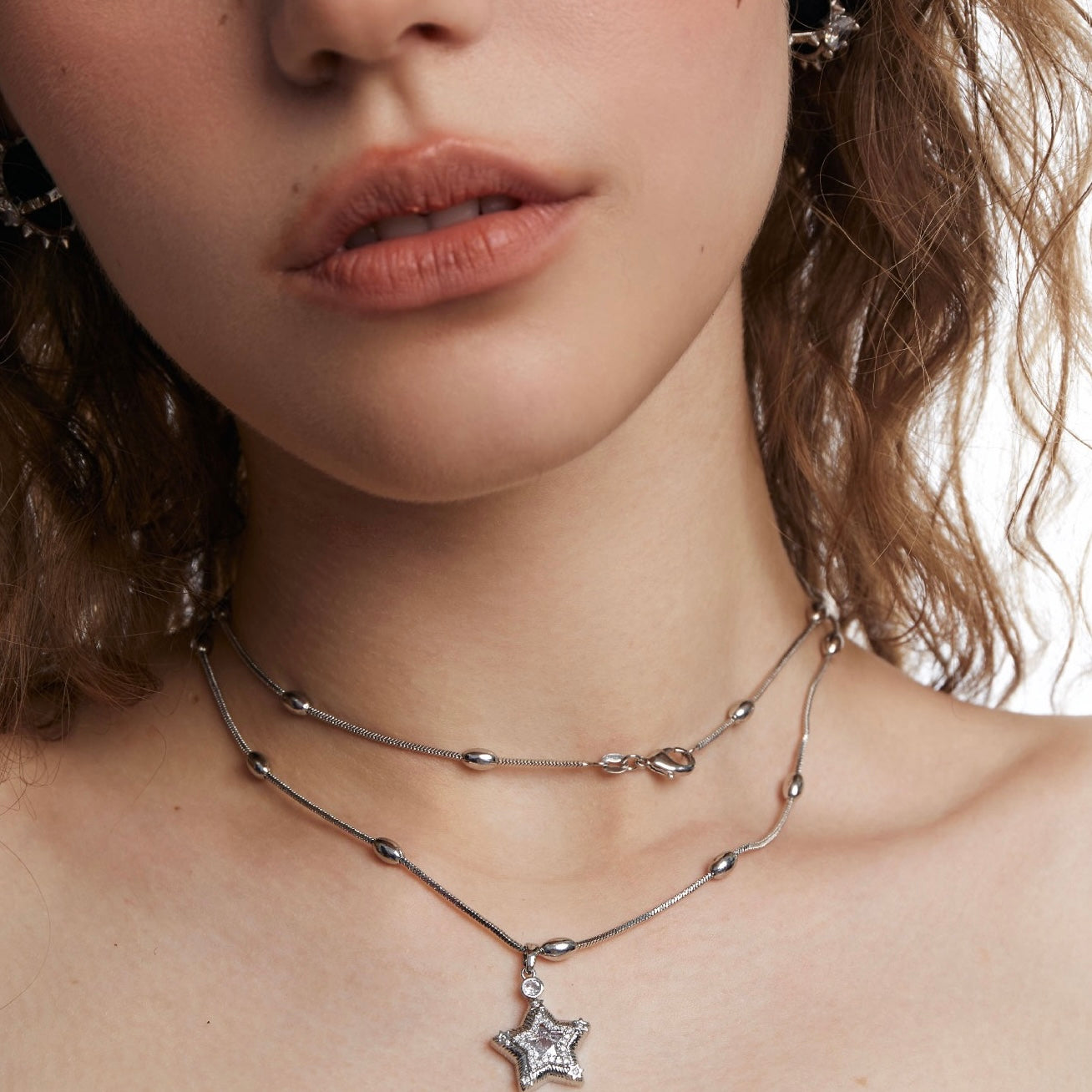 Collana a stella a doppio strato